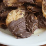 Chocolate-covered potato chips on a white plate